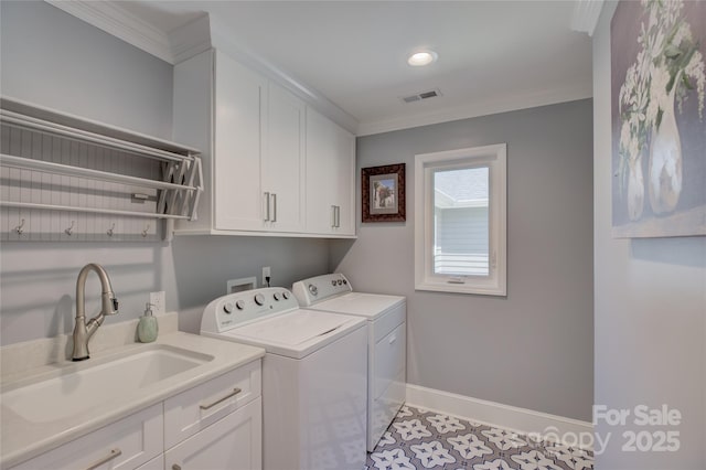 18205 Royal Oak Rd, Charlotte, NC 28278 - laundry area featuring independent washer and dryer, ornamental molding, cabinet space, light tile patterned flooring, and recessed lighting