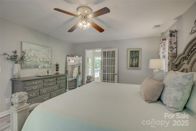 18205 Royal Oak Rd, Charlotte, NC 28278 - bedroom with wood finished floors and a ceiling fan