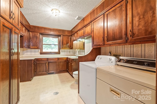 3985 Well Rd, Mint Hill, NC 28227 - washroom with washing machine and dryer, light floors, and a textured ceiling