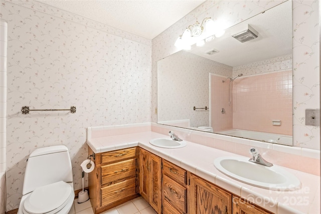 3985 Well Rd, Mint Hill, NC 28227 - bathroom featuring toilet, double vanity, bathing tub / shower combination, tile patterned flooring, and wallpapered walls