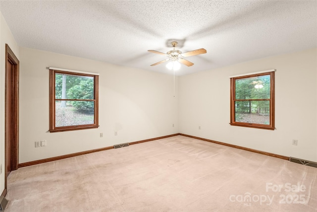 3985 Well Rd, Mint Hill, NC 28227 - unfurnished room with a ceiling fan, light colored carpet, a textured ceiling, and baseboards