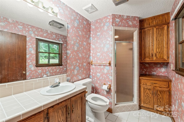 3985 Well Rd, Mint Hill, NC 28227 - bathroom with toilet, tile patterned floors, vanity, a shower stall, and a textured ceiling