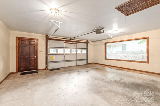 3985 Well Rd, Mint Hill, NC 28227 - garage featuring a garage door opener and baseboards