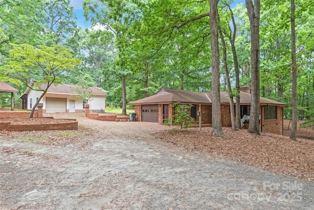 3985 Well Rd, Mint Hill, NC 28227 - single story home featuring dirt driveway, a garage, and brick siding