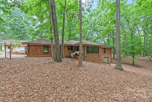 3985 Well Rd, Mint Hill, NC 28227 - view of front facade featuring brick siding and a chimney
