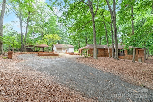3985 Well Rd, Mint Hill, NC 28227 - view of front of house featuring brick siding and view of wooded area