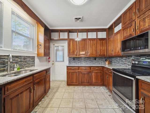 729 Montgomery Ave, Albemarle, NC 28001 - kitchen featuring stainless steel appliances, a sink, tasteful backsplash, light stone countertops, and open shelves