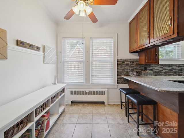 729 Montgomery Ave, Albemarle, NC 28001 - mudroom with radiator, a ceiling fan, healthy amount of natural light, ornamental molding, and light tile patterned flooring