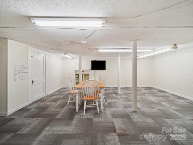 729 Montgomery Ave, Albemarle, NC 28001 - dining area featuring carpet flooring, a textured ceiling, and baseboards