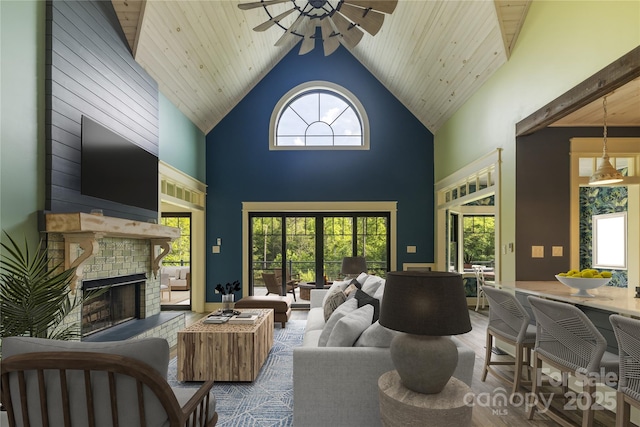 231 Bible School Rd, Lake Lure, NC 28746 - living room with a ceiling fan, a fireplace, high vaulted ceiling, and wood finished floors