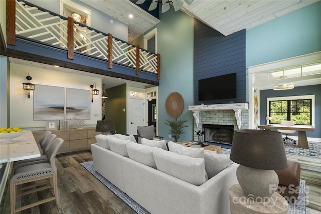 231 Bible School Rd, Lake Lure, NC 28746 - living room with a high ceiling, wood finished floors, and a large fireplace
