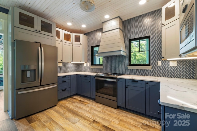 231 Bible School Rd, Lake Lure, NC 28746 - kitchen featuring appliances with stainless steel finishes, wall chimney range hood, wooden ceiling, recessed lighting, and backsplash