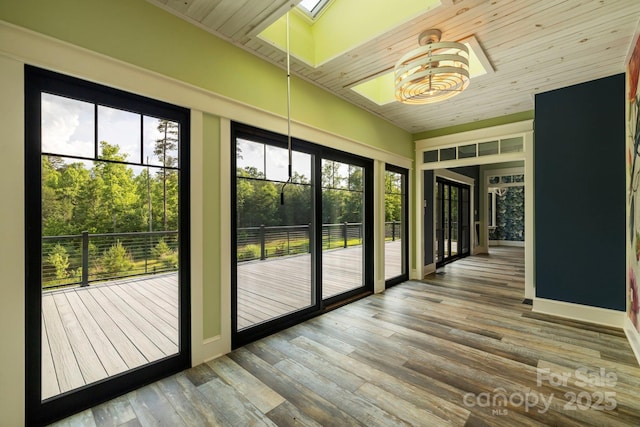 231 Bible School Rd, Lake Lure, NC 28746 - unfurnished sunroom featuring a skylight and vaulted ceiling