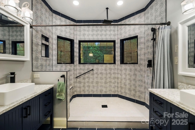 231 Bible School Rd, Lake Lure, NC 28746 - full bath featuring a shower stall, two vanities, and recessed lighting