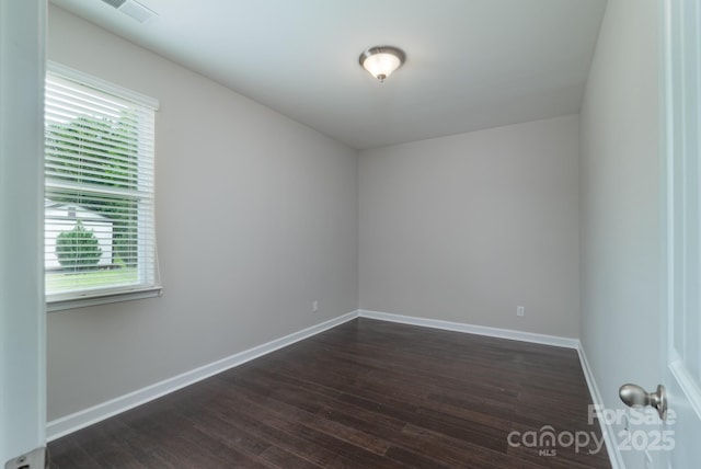 11922 Kimberfield Rd, Matthews, NC 28105 - spare room featuring dark wood-type flooring and baseboards
