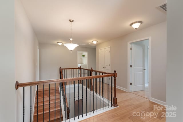 11922 Kimberfield Rd, Matthews, NC 28105 - corridor featuring an upstairs landing and wood finished floors