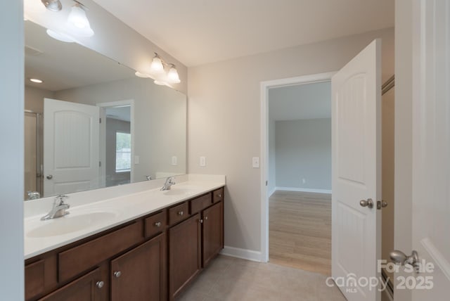 11922 Kimberfield Rd, Matthews, NC 28105 - full bathroom with double vanity and tile patterned flooring