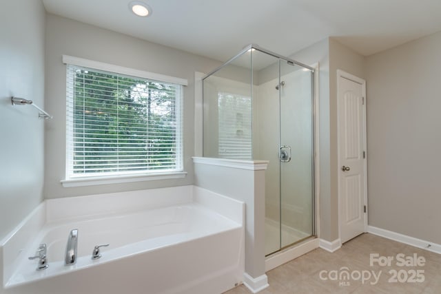 11922 Kimberfield Rd, Matthews, NC 28105 - bathroom with a bath, a shower stall, and tile patterned floors