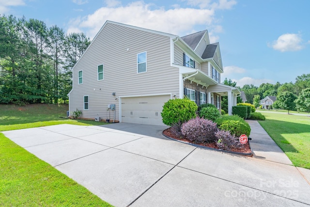 11922 Kimberfield Rd, Matthews, NC 28105 - view of side of home with a yard, a garage, and concrete driveway