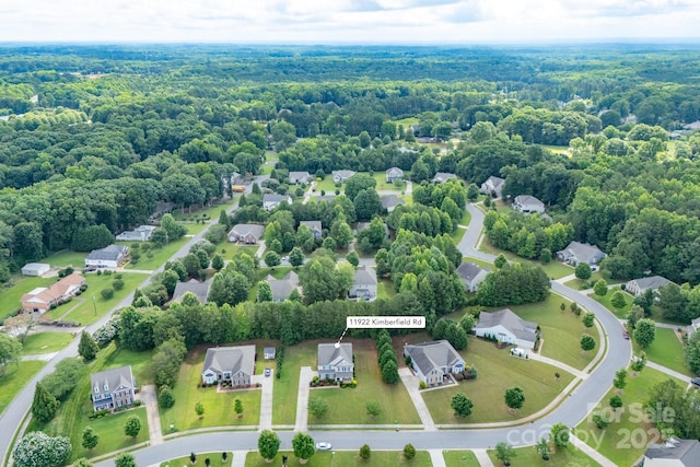 11922 Kimberfield Rd, Matthews, NC 28105 - aerial view of residential area featuring a heavily wooded area