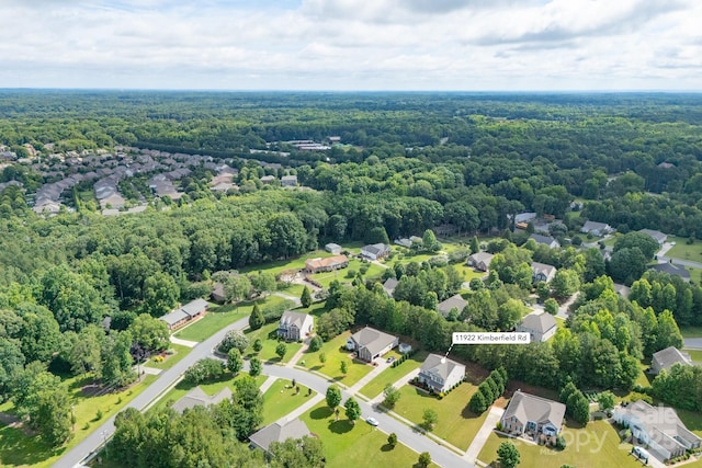 11922 Kimberfield Rd, Matthews, NC 28105 - aerial perspective of suburban area featuring a heavily wooded area