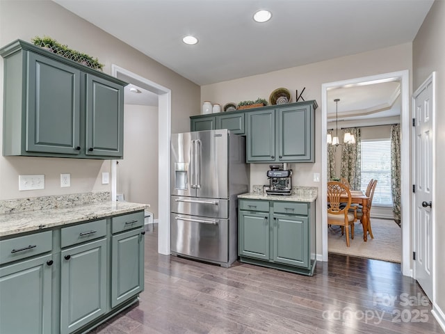 7700 Antique Cir, Waxhaw, NC 28173 - kitchen with high quality fridge, a chandelier, dark wood-type flooring, recessed lighting, and light stone countertops