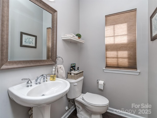 7700 Antique Cir, Waxhaw, NC 28173 - half bathroom with toilet and a sink