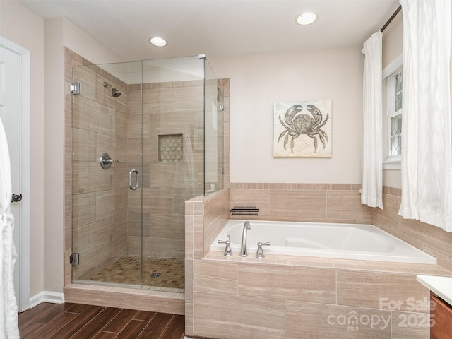 7700 Antique Cir, Waxhaw, NC 28173 - full bathroom featuring a bath, a shower stall, wood finished floors, vanity, and recessed lighting