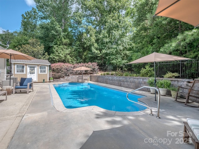 7700 Antique Cir, Waxhaw, NC 28173 - view of pool with a patio area, a fenced backyard, and an outdoor structure