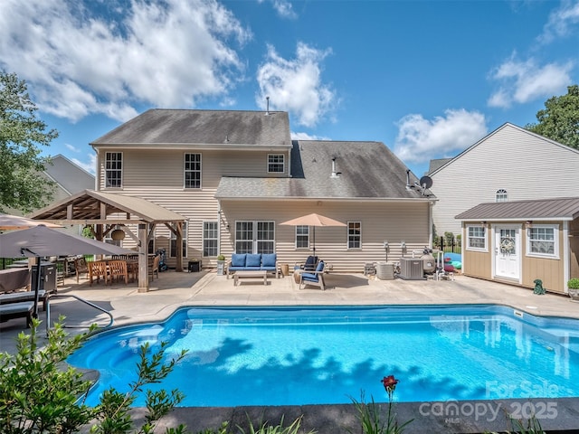 7700 Antique Cir, Waxhaw, NC 28173 - outdoor pool with an outdoor living space, a patio area, a gazebo, and an outdoor structure