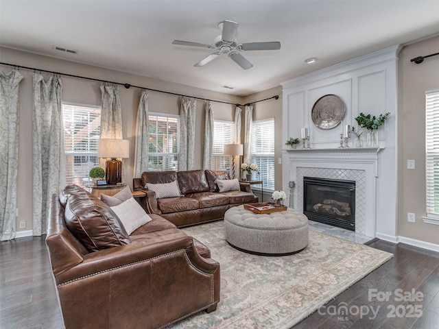 7700 Antique Cir, Waxhaw, NC 28173 - living area with a tiled fireplace, dark wood-style flooring, and a ceiling fan