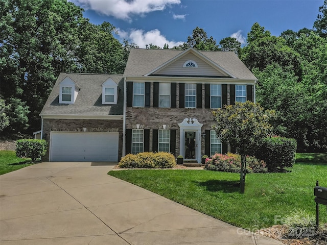 7700 Antique Cir, Waxhaw, NC 28173 - view of front of property with concrete driveway, a front yard, an attached garage, brick siding, and roof with shingles