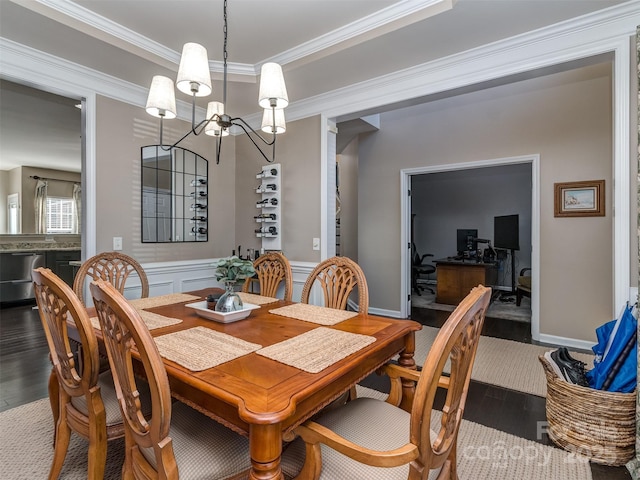 7700 Antique Cir, Waxhaw, NC 28173 - dining room featuring a chandelier, wood finished floors, crown molding, a wainscoted wall, and a desk