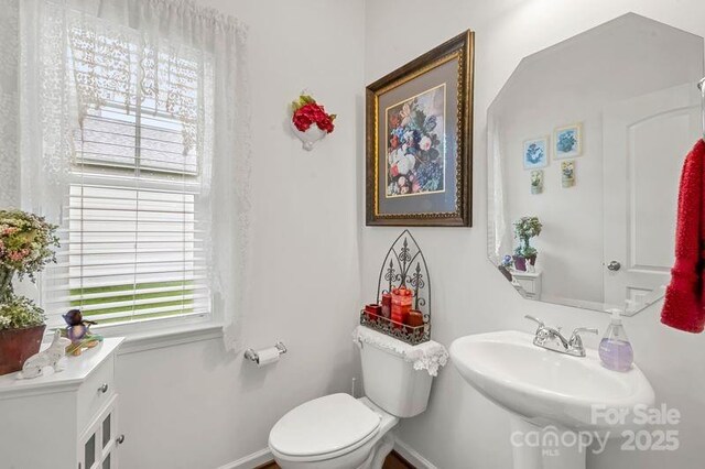 2399 Ashbourne Pl SE, Concord, NC 28025 - bathroom with toilet and baseboards