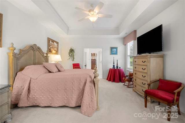 2399 Ashbourne Pl SE, Concord, NC 28025 - bedroom featuring light carpet, a tray ceiling, ceiling fan, and connected bathroom