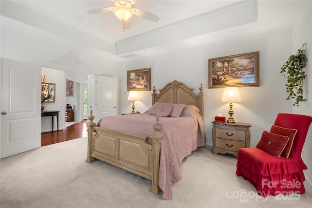 2399 Ashbourne Pl SE, Concord, NC 28025 - bedroom with a tray ceiling, light carpet, ornamental molding, and ceiling fan