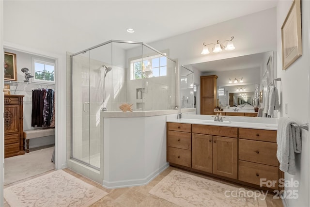2399 Ashbourne Pl SE, Concord, NC 28025 - bathroom featuring vanity, a shower stall, and plenty of natural light