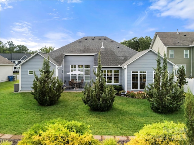 2399 Ashbourne Pl SE, Concord, NC 28025 - back of house with a patio area, a shingled roof, and a lawn