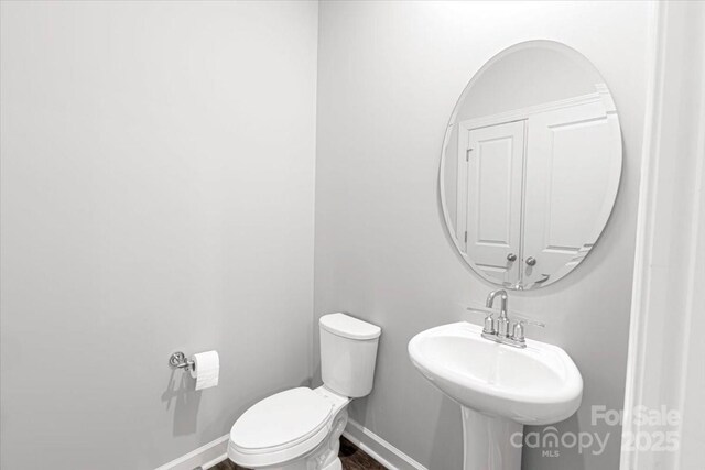 11965 Hambright Rd, Huntersville, NC 28078 - bathroom featuring toilet and baseboards