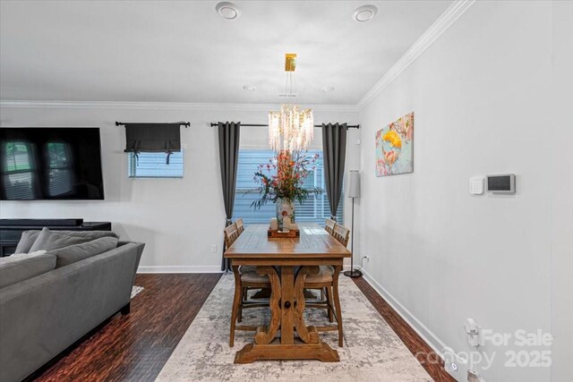 11965 Hambright Rd, Huntersville, NC 28078 - dining space featuring a chandelier, dark wood-style flooring, and crown molding