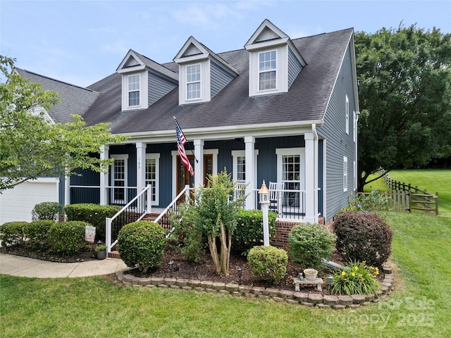 162 Castles Gate Dr, Mooresville, NC 28117 - cape cod-style house with covered porch, a front yard, a garage, and a shingled roof
