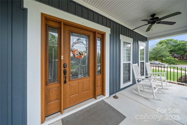 162 Castles Gate Dr, Mooresville, NC 28117 - entrance to property featuring board and batten siding, a porch, and ceiling fan