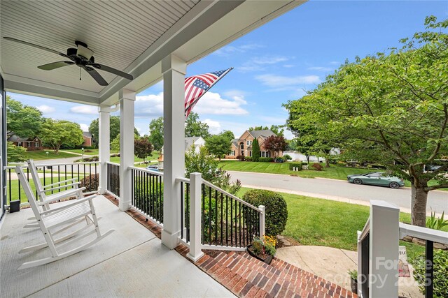 162 Castles Gate Dr, Mooresville, NC 28117 - porch featuring a ceiling fan, a lawn, and a residential view