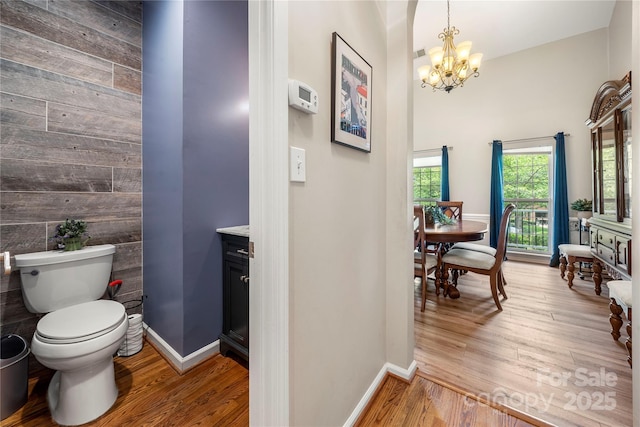162 Castles Gate Dr, Mooresville, NC 28117 - bathroom featuring a chandelier, vanity, and wood finished floors