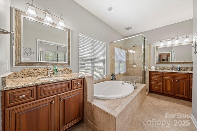 162 Castles Gate Dr, Mooresville, NC 28117 - full bath with a bath, two vanities, a stall shower, and tile patterned floors
