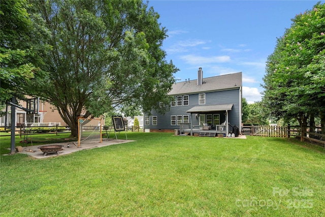 162 Castles Gate Dr, Mooresville, NC 28117 - back of property featuring an outdoor fire pit, a fenced backyard, a wooden deck, and a chimney