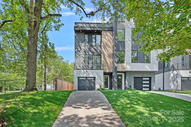 209 Keswick Ave, Charlotte, NC 28206 - modern home featuring concrete driveway, an attached garage, stucco siding, and a balcony