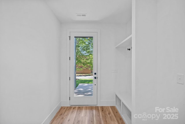 209 Keswick Ave, Charlotte, NC 28206 - doorway with light wood-style floors and baseboards