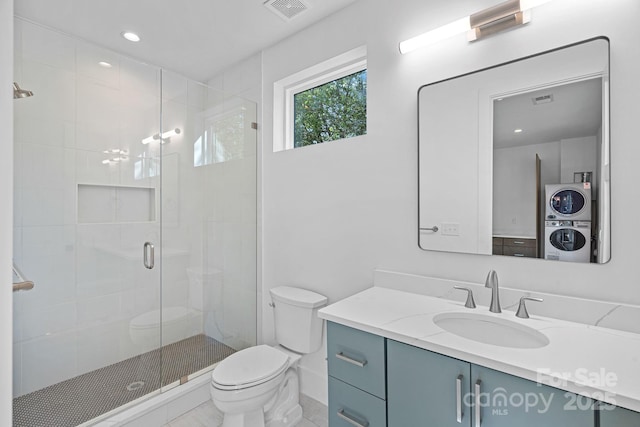 209 Keswick Ave, Charlotte, NC 28206 - bathroom with stacked washing machine and dryer, vanity, a shower stall, and recessed lighting