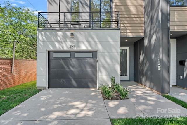 209 Keswick Ave, Charlotte, NC 28206 - view of front of home with a balcony, a garage, and concrete driveway
